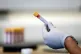 A paramedic holds a test tube containing a blood sample at a