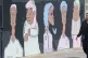  A woman passes a mural showing BAME medical, transport and 