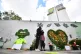 People at the Grenfell Memorial Community Mosaic next to the