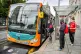 Passengers queue to board a bus in Cardiff