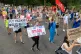 NHS workers observe social distancing as they march from St.