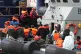 Refugees are escorted to the docks at Dover by border securi
