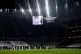 Players and officials observe a moment's silence in memory o