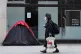 A homeless person's tent erected outside a furniture store i