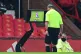 Referee Mike Dean reviewing the incident between Manchester 
