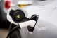 An electric car plugged into a charging point in central Lon