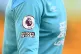The Premier League badge alongside the No room for racism ca