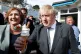 Prime Minister Boris Johnson eats an ice-cream as he visits 