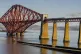 An LNER Azuma train crossing the Forth Bridge in Edinburgh