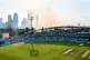 A general view of play as smoke from the pyrotechnics fills 