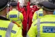 Red Rebels stand in the way of police during a protest by me