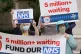 People take part in a protest outside Parliament in central 