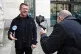 Tommy Robinson (left) arrives at Westminster Magistrates' Co