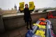 An Amnesty International campaigner wearing a Priti Patel ma