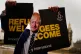 An Amnesty International campaigner wearing a Boris Johnson 