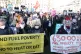 People in Parliament Square, London, take part in the People