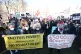 People in Parliament Square, London, take part in the People