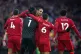Liverpool goalkeeper Alisson is congratulated on his pass to