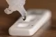 A testing solution dripping into a Covid 19 lateral flow tes