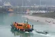 A group of people are brought in to Dover, Kent, onboard an 