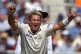 Australia's Shane Warne celebrates taking the wicket of Engl