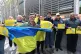 Flag bearer Myron Tytko and other supporters hold banners as