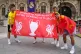 Liverpool fans hold up a flag at the Trophy Experience at Th