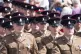 Crowds watch the parade of military personnel in Scarborough