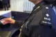A Border Force officer checking passports