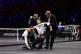 Stewards remove a protester after setting fire to the court 