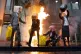 Ocean Rebellion activists demonstrate by vomiting fake oil a
