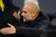 Manchester City manager Pep Guardiola (right) embraces Arsen