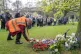 People lay wreaths at the annual International Workers' Memo