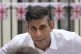 Prime Minister Rishi Sunak speaks to guests during a Coronat