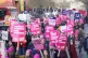 Protesters march during a rally as members of the University