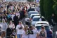 People attend a vigil for the victims of a road traffic coll