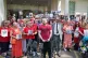 People hold pictures of loved ones lost during the pandemic 