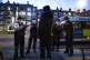 Police officers and special constables talking to a suspect 