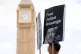People protest outside the Houses of Parliament in London, t