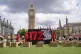 Activists from Shelter stage a protest in Parliament Square,