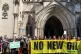 Protestors gather outside the Royal Courts of Justice in Lon