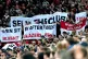 Manchester United fans hold up banners in protest to the own