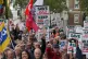 People take part in a protest organised by the Rail, Maritim