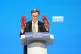 Chairman of the Conservative Party Greg Hands holds up a pai
