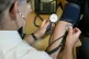 A GP checking a patient's blood pressure, September 10, 2014