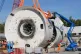 Work begins to lift the front shield from the 2,000-tonne tu