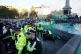 Police officers arrest a protester in Trafalgar Square durin