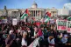 People at a rally in Trafalgar Square, London, during Stop t