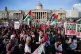 People at a rally in Trafalgar Square, London, during Stop t