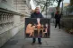 Political artist Kaya Mar with a painting outside Downing St